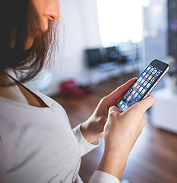 Customer with mobile phone in hands